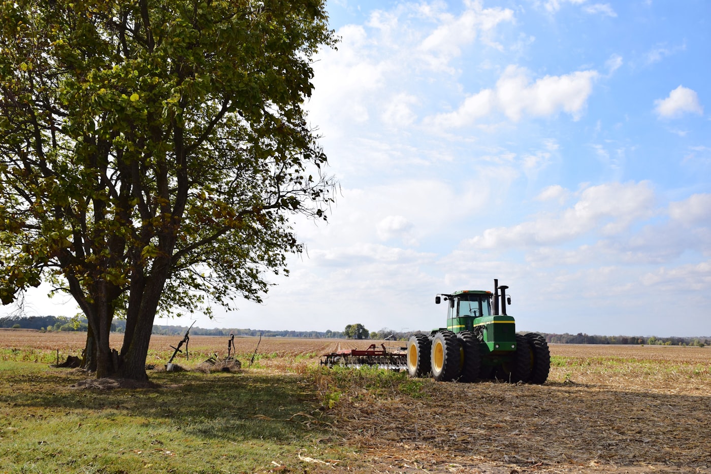 Tractor with plough in a field